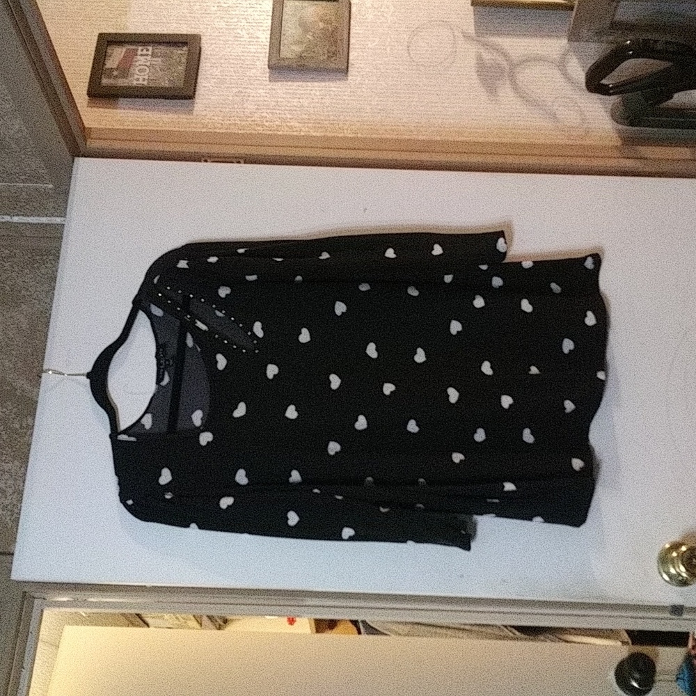 Sweater wth oval cutout on left shoulder